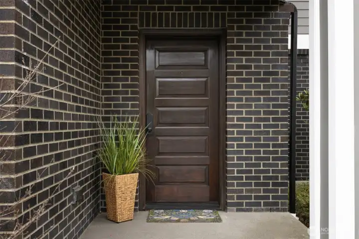 Elegant covered entry with newly sealed door