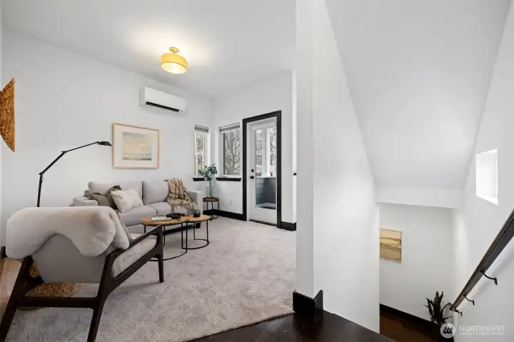 There is new paint & carpet throughout! The door opens to a sweet patio and there is wiring for a wall mounted TV to the right of the stairs