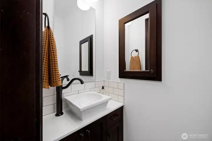 Privately situated 1/2 bath off the laundry room