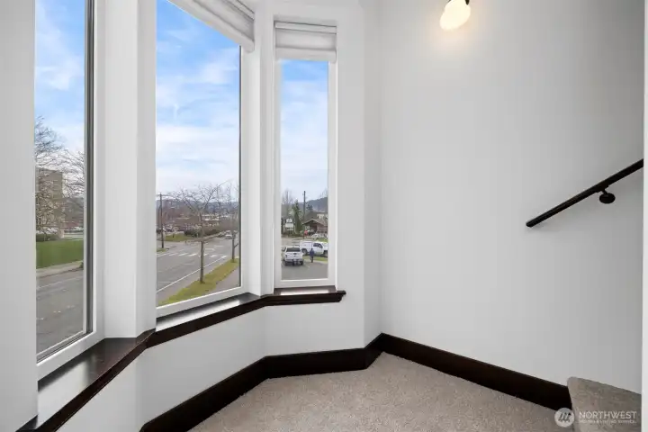 This lovely bay window floods the staircase with light!