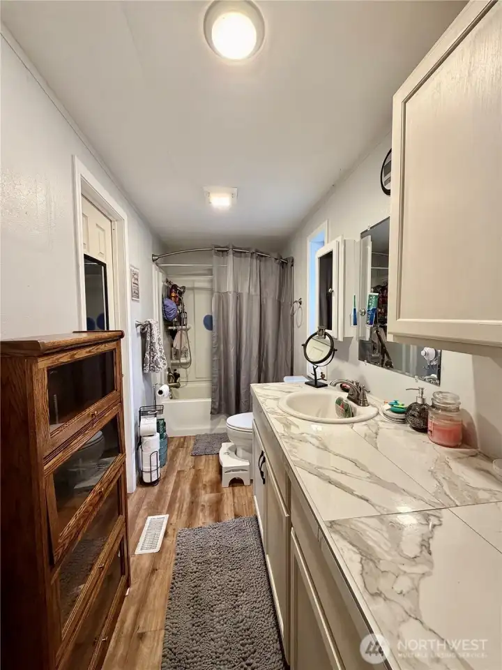 Primary bath.  Connects to laundry area.