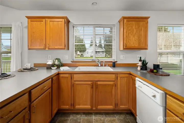 "U" shaped kitchen provides convenience to all appliances.