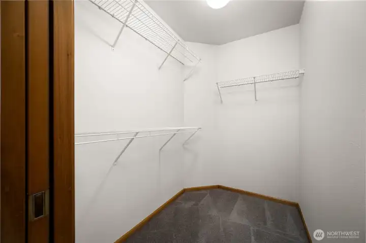 The walk-in primary closet will hold all your wardrobe.