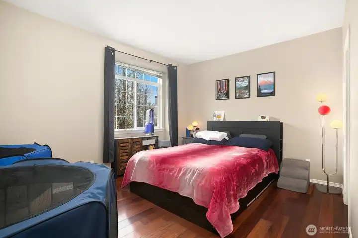 The primary suite offers ample space for larger furniture...