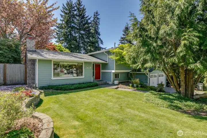 The home sits back from the road with a nice level front yard.