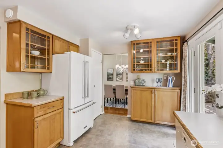 Lots of cabinet space. Note the glass doors.