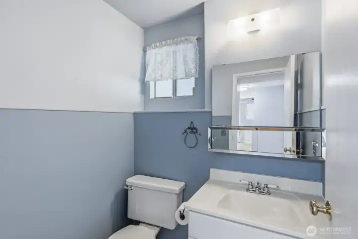 Off of the family room is the powder room.