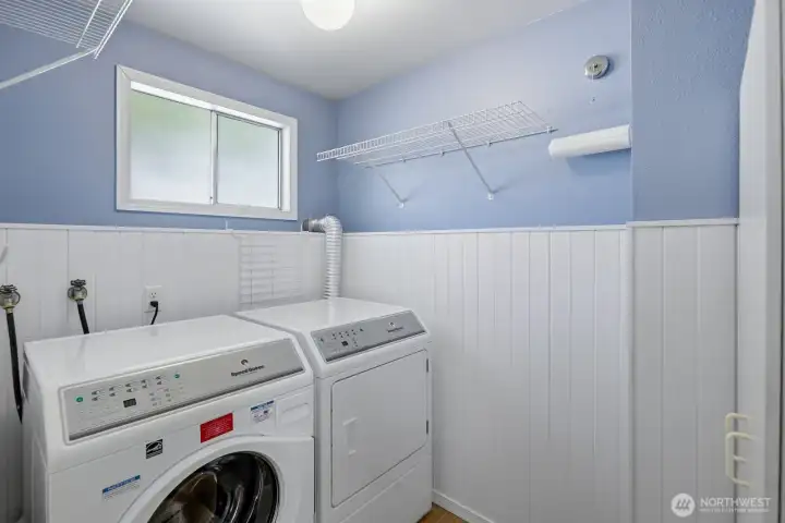 Light & bright full size utility room.