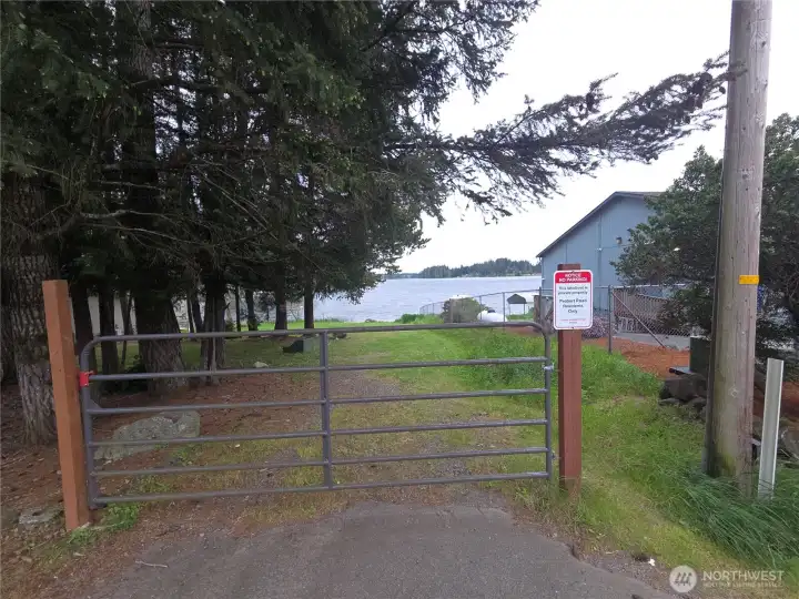 This is your Spencer lake access to the left of Spencer lake bar & grill This is your Spencer lake access to the left of Spencer lake bar & grill