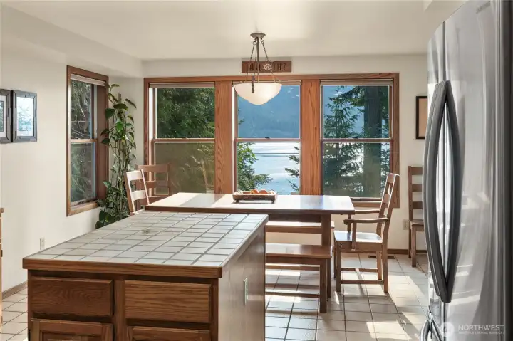 Kitchen looking out at the lake over the dining room.