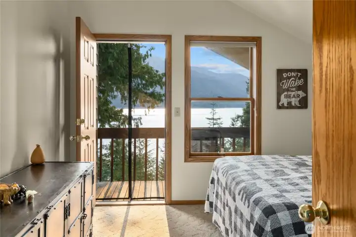 Upstairs bedroom with a balcony.