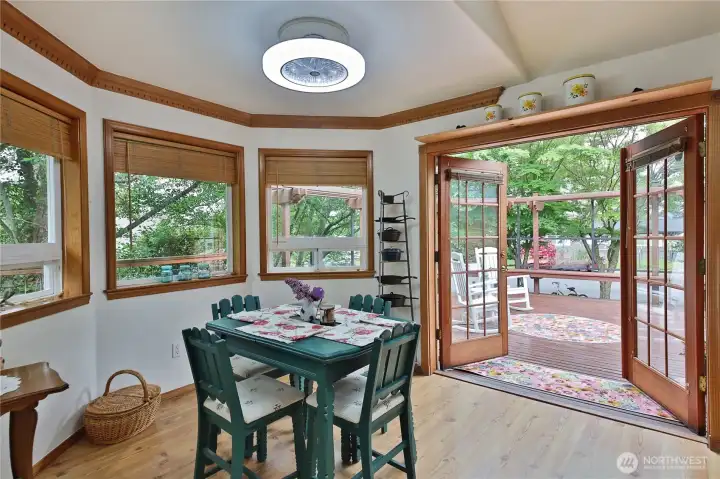 Another bay window. Notice the crown moulding and inviting french doors.