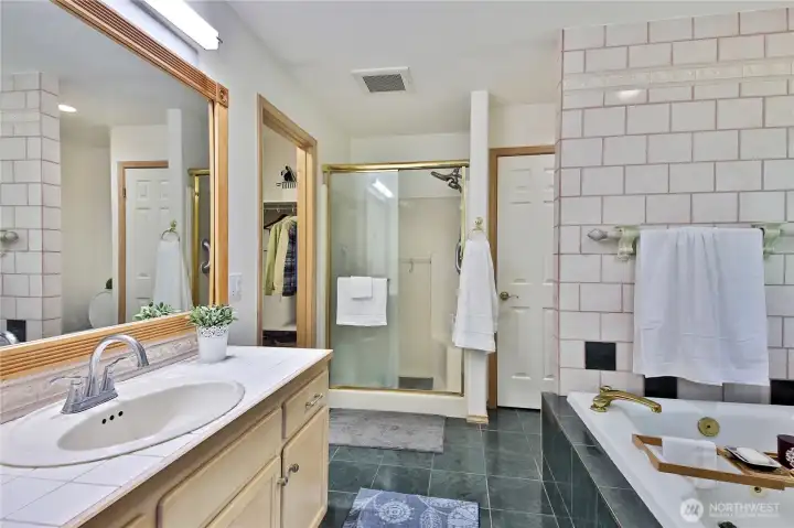 A well appointed bathroom with jetted soaking tub.