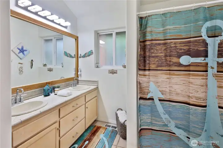And the full, shared bathroom with double vanity.