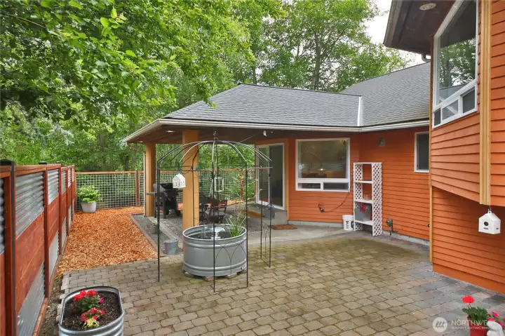 The backyard is low maintenance with no grass to cut.