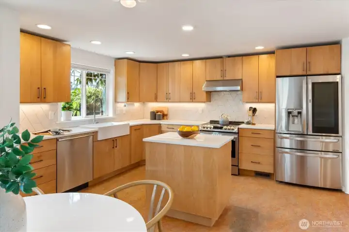 Off the living room, find the spacious kitchen with quartz counters and Stainless Steel appliances.