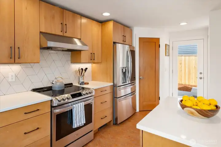 The kitchen has a back door leading to the back patio area.
