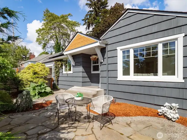 Find a well-tended front patio as you enter the property.