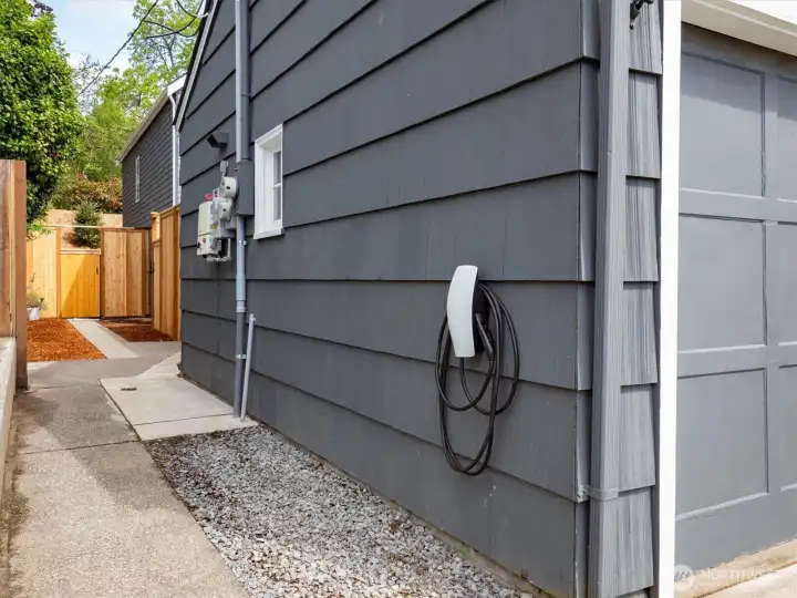Just off the garage is the Tesla charger.