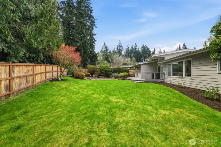 Private backyard setting with mature landscaping