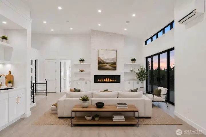 Vaulted fireside great room... Photo is virtually staged.