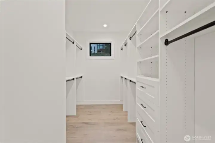 Huge custom primary walk-in closet!