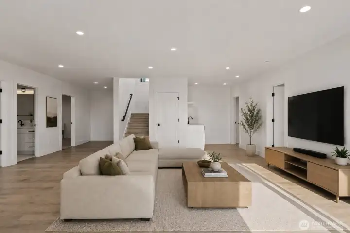 Downstairs, enjoy oversized rec/bonus room... Photo is virtually staged.