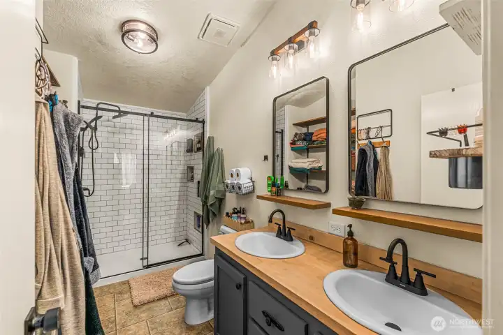 attached primary bathroom with tiled shower attached primary bathroom with tiled shower