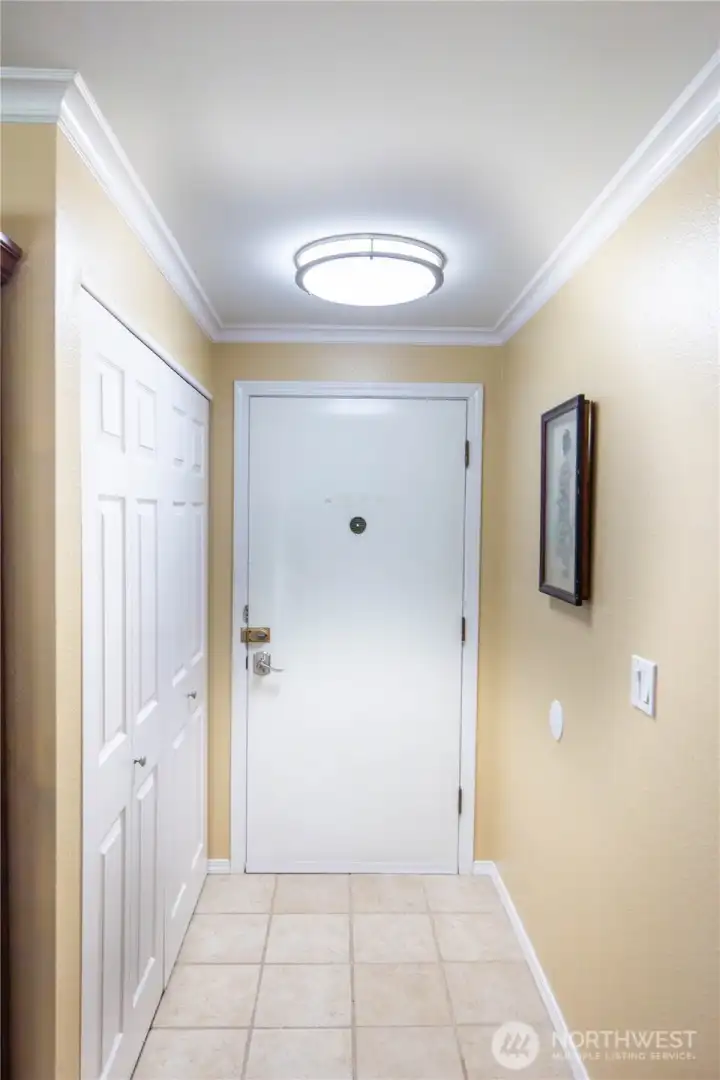 Entering the front door, you can hang your coats and store shoes and other essentials in this large closet.