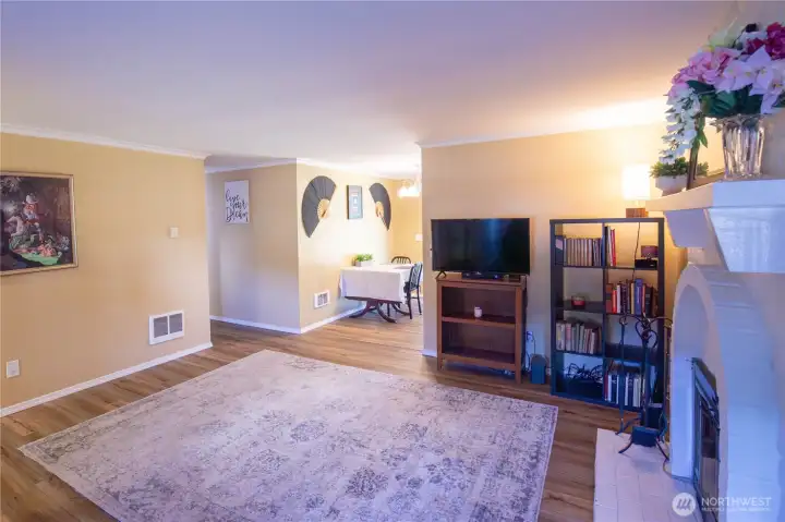 This open living room is spacious and open to the dining area and kitchen.