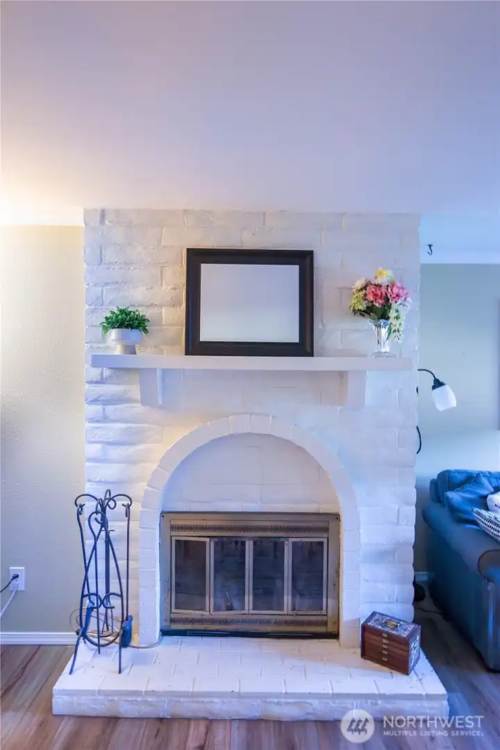 The wood burning fireplace in the main living / great room area offers cozy warm evenings ahead.
