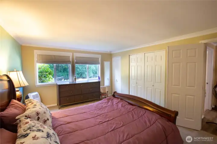 Enter the large primary ensuite thru double doors to see the private 3/4 bath, double closets and view of the calming river nearby.