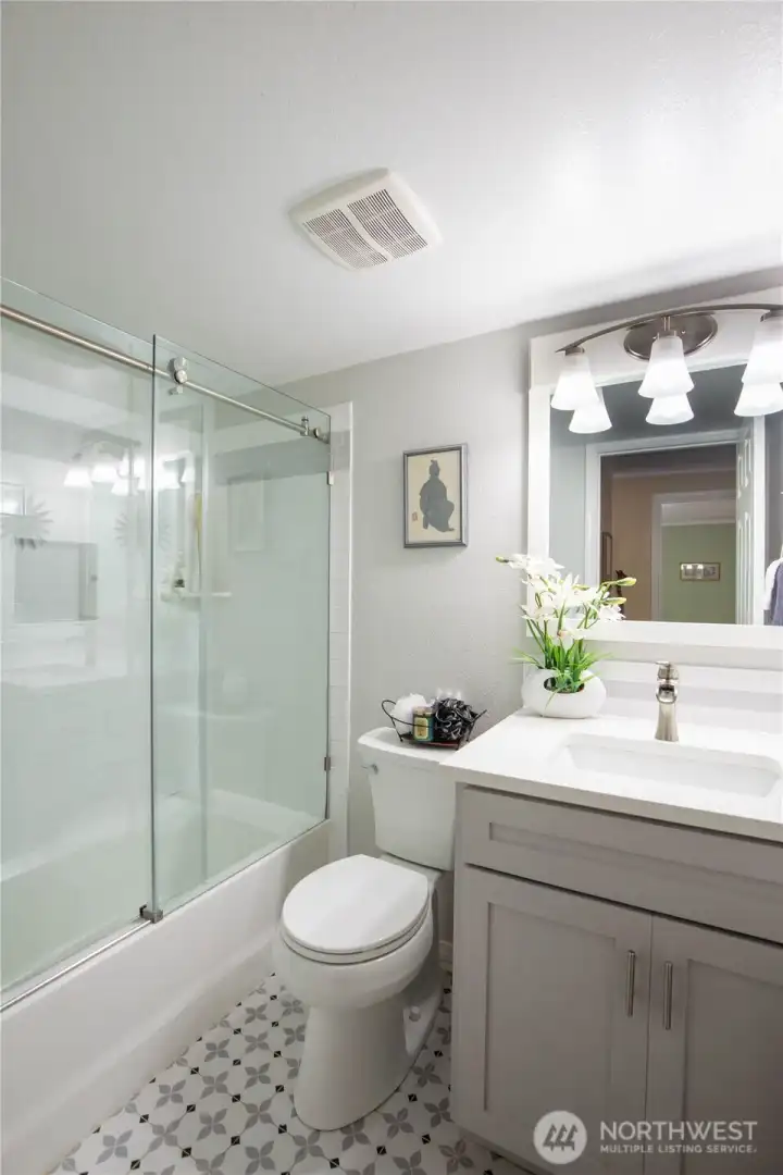 The full bathroom has been tastefully updated and is located just steps from the 2nd bedroom in the hall.