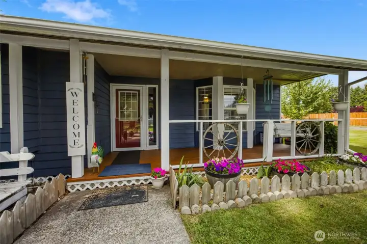 Large, welcoming covered front porch provides outdoor seating year round.