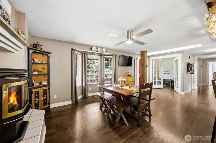 Looking back at dining space, you can see the front bedroom with french doors.