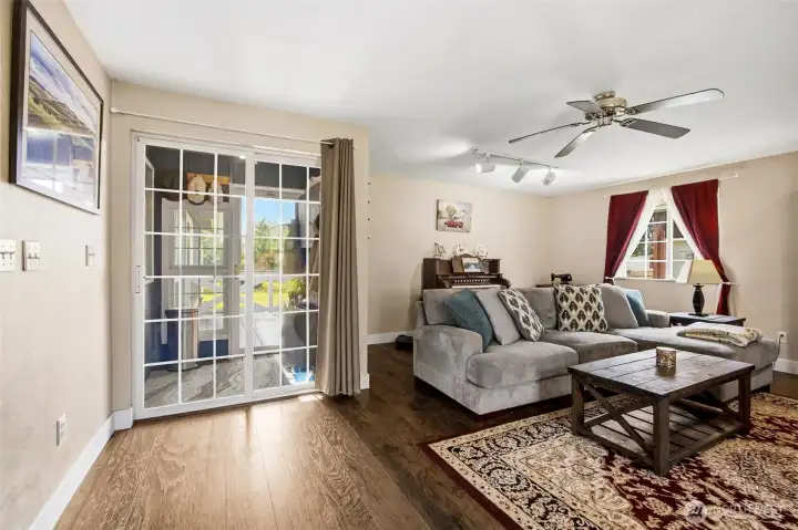 Enclosed mud room off of the living room and back deck is a great spot to leave your shoes after playing in the yard!