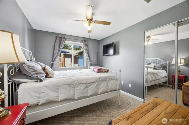 Second bedroom down the hall with a view into the back yard.