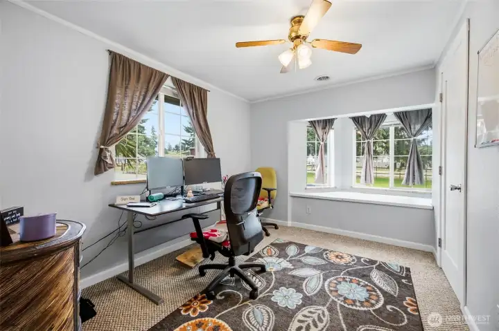 First room off of the sitting room, currently being used as an office. This room has a walk in closet and XL window seat with tons of storage below it!