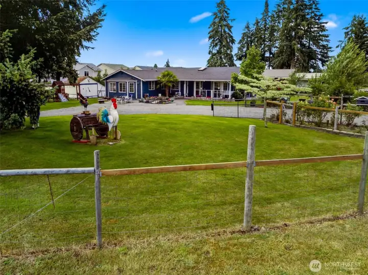Fencing all around, and large shed/chicken coop shown here to the left of the house.