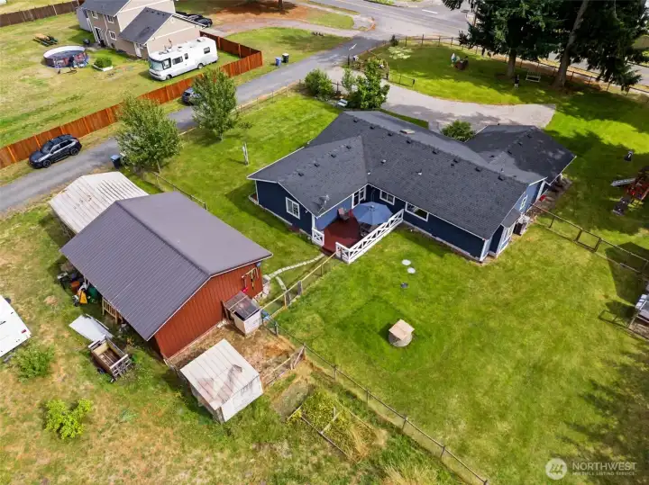 Fenced yard area is beautiful and green. Shop has tons of space to tinker or park vehicles.