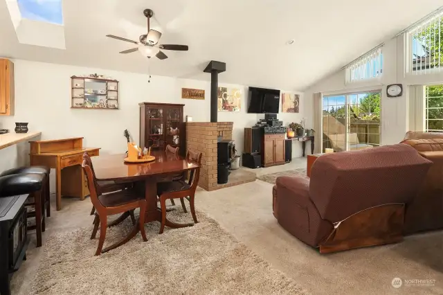 Open floor plan has spacious living room and dining room.  The woodstove is perfect for Northwest winters.