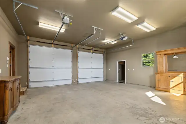 Spacious HEATED garage with  garbage room