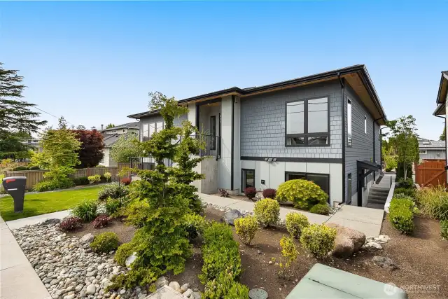 The attached apartment, located on the east side of the home, features its own exterior entrance. Inside, you'll find a spacious layout with one bedroom, one bathroom, a full kitchen, laundry facilities, and a comfortable living room.