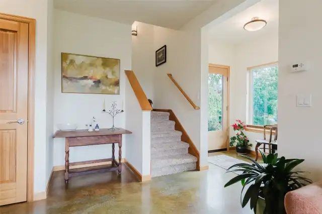 Front door entrance and stairs from living room