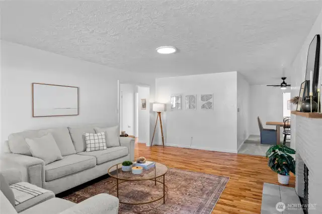 LIVING ROOM | Pass through the front living room to the bedrooms and bathroom on the left or through the dining room on the right.