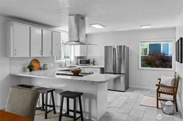 EAT-IN KITCHEN | Who doesn't love space at the counter for eating or doing homework? This open concept kitchen will steal your heart.