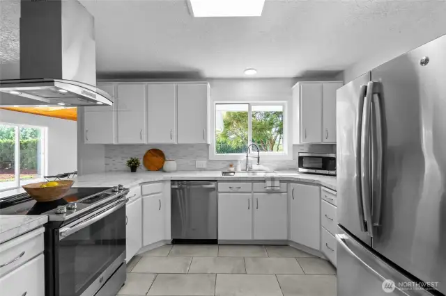 KITCHEN | The view from this kitchen window will make dishes a pleasure. Not to mention there's a nice deep stainless steel sink for those big pots and pans.