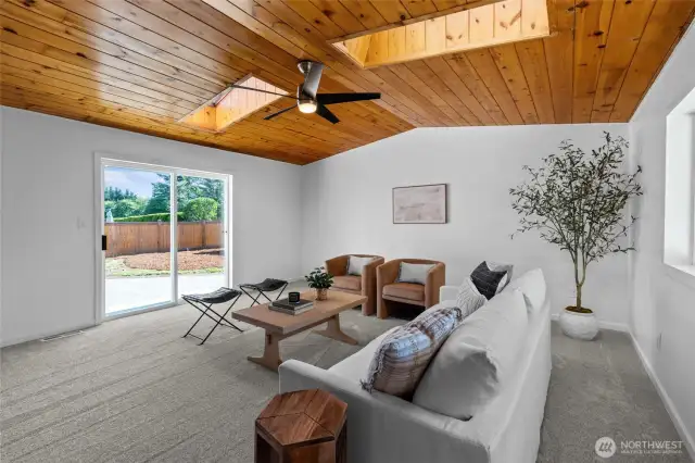 GREAT ROOM | This really great great room is a beautiful space that features new luxury carpet, new ceiling fan, wood ceiling and big windows for an abundance of natural light.