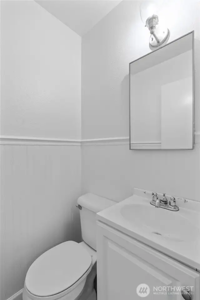 BONUS BATHROOM | Located off the mudroom this half-bathroom is a welcome addition to the functionality of the home.