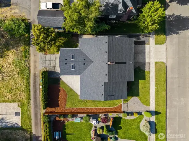 Vacant county land on the other side of the alley acts as an extension of the the backyard and hosts a neighborhood basketball hoop!